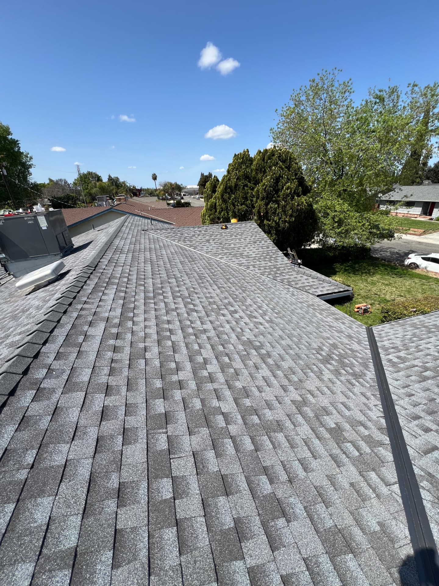 Completed gray architectural shingle roof on a Visalia home