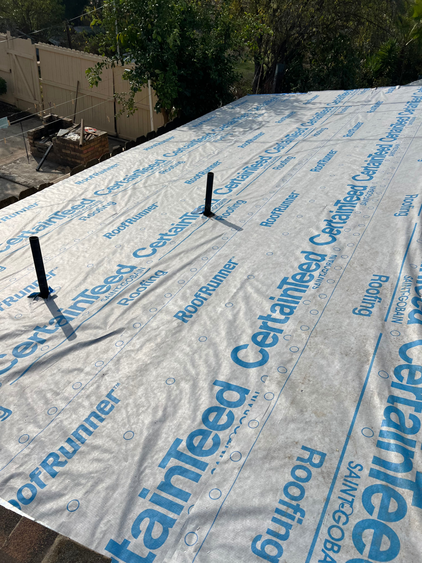Residential roof deck protected with CertainTeed RoofRunner synthetic underlayment
