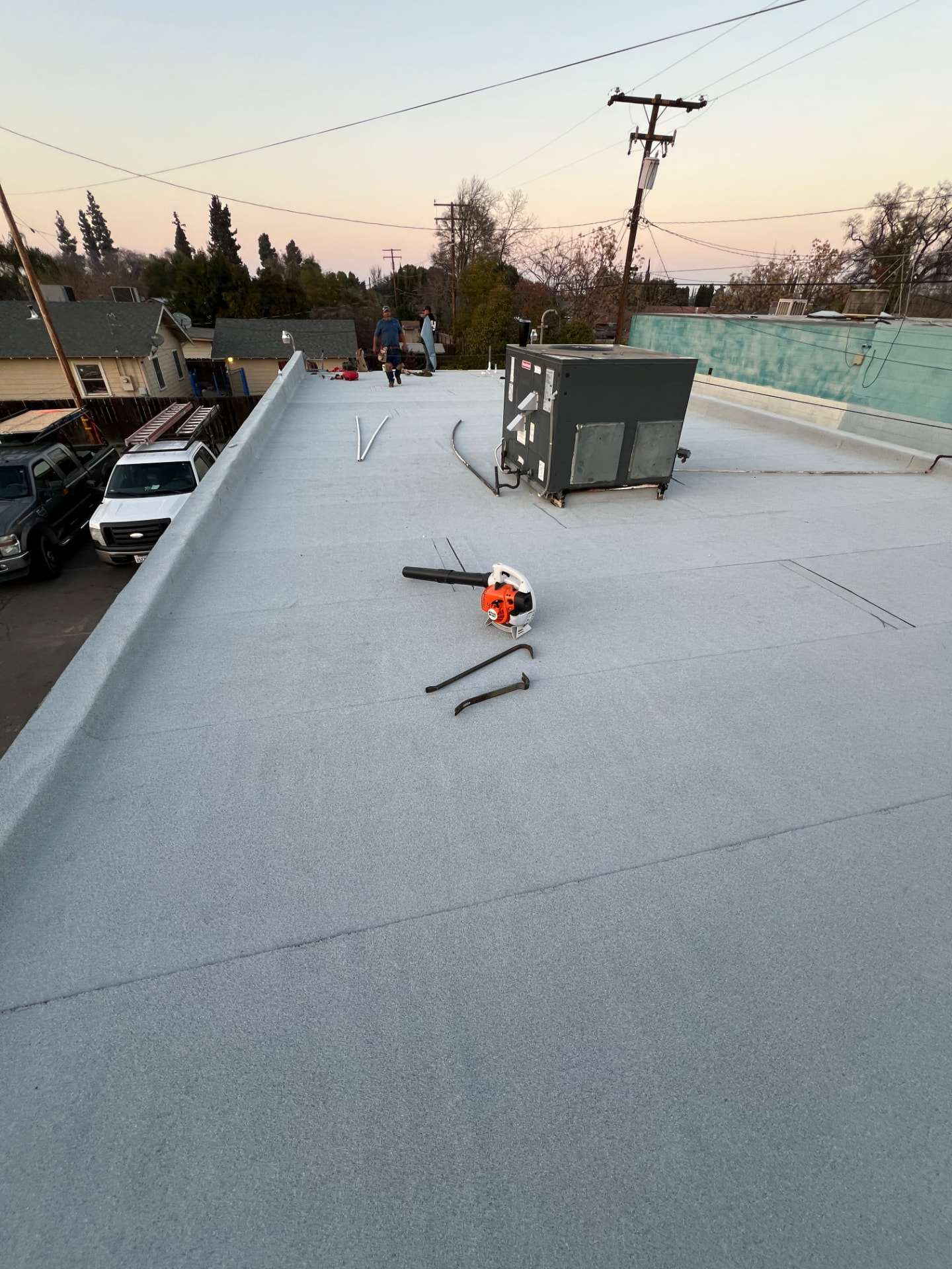 Finished flat commercial roof with rooftop HVAC unit in Visalia